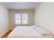 Bright bedroom with a neutral color scheme, large window, and hardwood floors at 2418 2Nd S Ave, St Petersburg, FL 33712