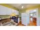 Efficient kitchen layout with white cabinets, granite counters, and modern appliances at 2418 2Nd S Ave, St Petersburg, FL 33712