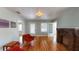Charming living room with hardwood floors, brick fireplace, and ample natural light at 2418 2Nd S Ave, St Petersburg, FL 33712