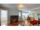 Spacious living room featuring a brick fireplace, hardwood floors, and ample natural light at 2418 2Nd S Ave, St Petersburg, FL 33712