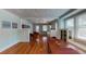 Open-concept living and dining area with hardwood floors and large windows at 2418 2Nd S Ave, St Petersburg, FL 33712