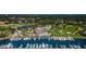Stunning aerial view of the community showcasing the golf course, marina, clubhouse, and surrounding lush landscape at 2775 Kipps Colony S Dr # 105, Gulfport, FL 33707