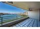 Beautiful waterfront views from the spacious tiled balcony with ceiling fan at 2775 Kipps Colony S Dr # 105, Gulfport, FL 33707
