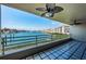 Expansive balcony with a ceiling fan overlooking tranquil waterfront views at 2775 Kipps Colony S Dr # 105, Gulfport, FL 33707