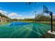 Outdoor basketball and tennis court with blue and green surface, and court fixtures at 2775 Kipps Colony S Dr # 105, Gulfport, FL 33707