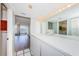 The bathroom features a large vanity area, lots of storage, plus access to the balcony at 2775 Kipps Colony S Dr # 105, Gulfport, FL 33707