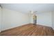 The home offers a spacious bedroom with wood floors and a ceiling fan at 2775 Kipps Colony S Dr # 105, Gulfport, FL 33707