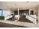Elegant clubhouse entry with steps, railings, and a seating bench at 2775 Kipps Colony S Dr # 105, Gulfport, FL 33707