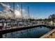Community boat docks in a marina setting featuring boats, slips, and sunny skies at 2775 Kipps Colony S Dr # 105, Gulfport, FL 33707