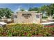 Community entrance sign for Pasadena Yacht & Country Club with landscaping and decorative stone at 2775 Kipps Colony S Dr # 105, Gulfport, FL 33707