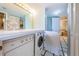 The bathroom features an in-unit washer and dryer, and a large storage closet at 2775 Kipps Colony S Dr # 105, Gulfport, FL 33707