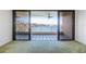 Living space featuring sliding glass doors to balcony with waterfront views at 2775 Kipps Colony S Dr # 105, Gulfport, FL 33707