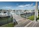 Community marina view with dock access, secure gate, and multiple boat slips at 2775 Kipps Colony S Dr # 105, Gulfport, FL 33707