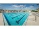 Inviting swimming pool with lap lanes, surrounded by lounge chairs, perfect for exercise and relaxation at 2775 Kipps Colony S Dr # 105, Gulfport, FL 33707