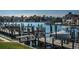 Picturesque waterfront view featuring well-maintained docks, boat lifts, and luxury homes in the background at 2775 Kipps Colony S Dr # 105, Gulfport, FL 33707