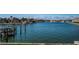 Beautiful waterfront view overlooking the canal showcasing boat docks and luxurious waterfront homes at 2775 Kipps Colony S Dr # 105, Gulfport, FL 33707