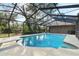 Enjoy this inviting screened-in pool with diving board and sunning areas at 3503 Hollow Oak Pl, Brandon, FL 33511