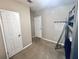 Neutral bedroom featuring a bunk bed with basketball hoop and standard closet with white doors at 37544 Corey Lewis Ave, Zephyrhills, FL 33541