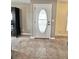 Welcoming entryway featuring decorative front door and tile flooring at 37544 Corey Lewis Ave, Zephyrhills, FL 33541