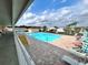 Bright outdoor community pool with brick trim and multiple lounge chairs at 37544 Corey Lewis Ave, Zephyrhills, FL 33541