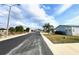 Street view of Grand Horizons neighborhood with palm trees and landscaping at 37544 Corey Lewis Ave, Zephyrhills, FL 33541