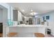 Spacious kitchen featuring modern appliances, white countertop, and bar stool seating at 5507 Darlene St, Spring Hill, FL 34607