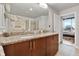 Bathroom boasts double sinks with granite countertops and a clear view to the bedroom at 777 N Ashley Dr # 1614, Tampa, FL 33602