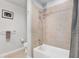 Neutral bathroom featuring a combined shower and tub with tiled walls and modern fixtures at 777 N Ashley Dr # 1614, Tampa, FL 33602