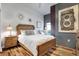 Relaxing bedroom featuring rustic wood furniture, modern decor, and a comfortable bed at 777 N Ashley Dr # 1614, Tampa, FL 33602