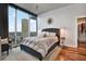 Bedroom featuring a skyline view, a large bed, and walk-in closet at 777 N Ashley Dr # 1614, Tampa, FL 33602