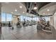 Well-equipped gym with treadmills, elliptical machines and skyline views from floor to ceiling windows at 777 N Ashley Dr # 1614, Tampa, FL 33602