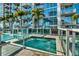 Modern rooftop hot tub with glass surrounds and views of tropical landscaping and city buildings at 777 N Ashley Dr # 1614, Tampa, FL 33602