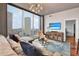 Well-decorated living room with city views, a sectional, a TV and stylish decor at 777 N Ashley Dr # 1614, Tampa, FL 33602