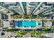 Aerial view of a rectangular pool surrounded by palm trees and comfortable lounge chairs at 777 N Ashley Dr # 1614, Tampa, FL 33602