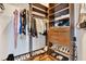 Organized walk-in closet with shelves, drawers, hanging rods and visible hardwood floors at 777 N Ashley Dr # 1614, Tampa, FL 33602
