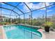 The inviting screened-in pool offers the perfect outdoor relaxation at 8733 Sorano Villa Dr, Tampa, FL 33647