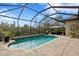 Beautiful pool in screened lanai with brick pavers and outdoor seating area at 8733 Sorano Villa Dr, Tampa, FL 33647