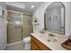 Cozy bathroom featuring a vanity with elegant countertops, a toilet, and a shower at 9204 Golf View Dr, New Port Richey, FL 34655