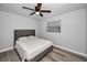 Comfortable bedroom with ceiling fan and natural light streaming through the window at 9204 Golf View Dr, New Port Richey, FL 34655