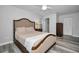 Bedroom with wood-look floors, neutral tones, and closet at 9204 Golf View Dr, New Port Richey, FL 34655