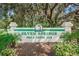 Seven Springs Golf and Country Club signage with mature landscaping at 9204 Golf View Dr, New Port Richey, FL 34655