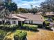 Charming single-story home with mature landscaping, offering a peaceful and inviting curb appeal at 9204 Golf View Dr, New Port Richey, FL 34655