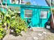 Cozy backyard area with an outdoor shower and convenient garden hose setup at 100 Waverly Way # 302, Clearwater, FL 33756