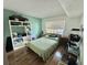 Comfortable bedroom with warm natural lighting, offering ample shelving, and a relaxing atmosphere at 100 Waverly Way # 302, Clearwater, FL 33756