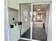 Close up of the building's entrance and inner lobby with information and door at 100 Waverly Way # 302, Clearwater, FL 33756