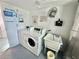 Clean laundry facility with modern washing machines and app-based access for easy use at 100 Waverly Way # 302, Clearwater, FL 33756
