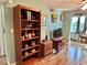Cozy living room featuring hardwood floors, vintage decor, and natural lighting at 100 Waverly Way # 302, Clearwater, FL 33756