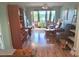 Bright living room with hardwood floors, comfortable seating, and large windows offering views at 100 Waverly Way # 302, Clearwater, FL 33756