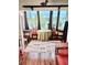 Comfortable sitting area near a picture window with stylish area rug and warm natural lighting at 100 Waverly Way # 302, Clearwater, FL 33756