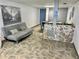 Inviting lobby featuring a stone-accented reception desk, comfortable seating, and unique artwork at 100 Waverly Way # 302, Clearwater, FL 33756